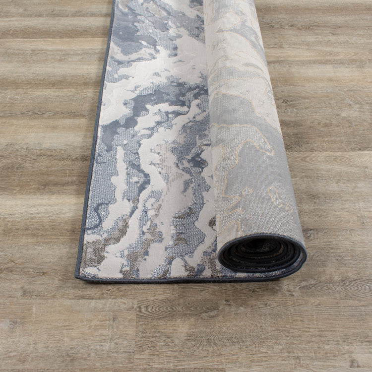 Alfombra Intrigue Rushing Water en beige/azul/crema de Kalora Interiors