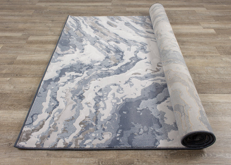 Alfombra Intrigue Rushing Water en beige/azul/crema de Kalora Interiors