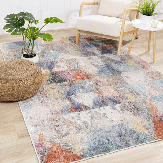 Alfombra con patrón triangular Fresco envejecido gris rosa azul amarillo de Kalora Interiors