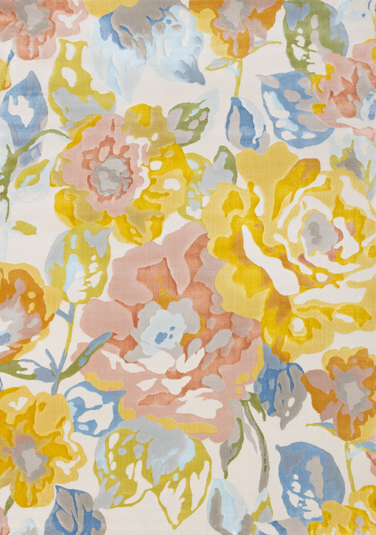 Alfombra Belle con diseño floral en amarillo, azul y rosa de Kalora Interiors