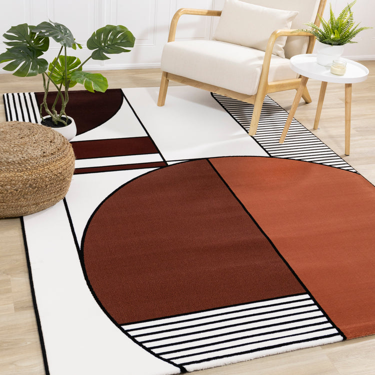 Alfombra de felpa geométrica Art Déco en blanco, negro, naranja Claro de Kalora Interiors